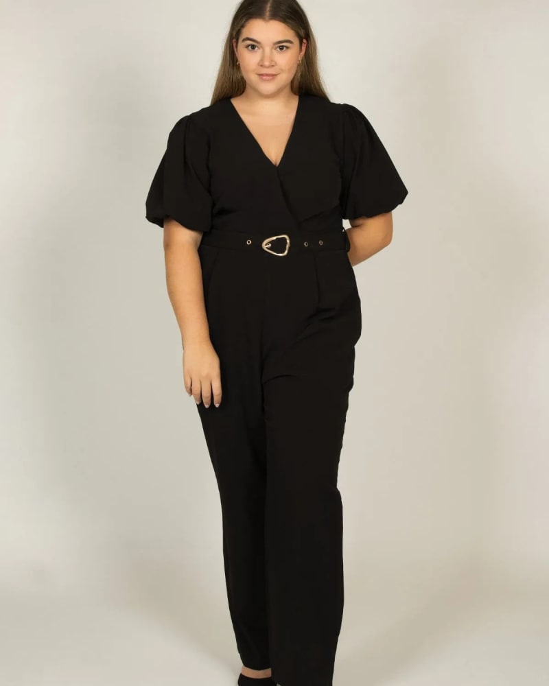 Front of a model wearing a size 1X Apolline Jumpsuit Self Belted Puff Sleeves Black in Black by ANNICK. | dia_product_style_image_id:317721